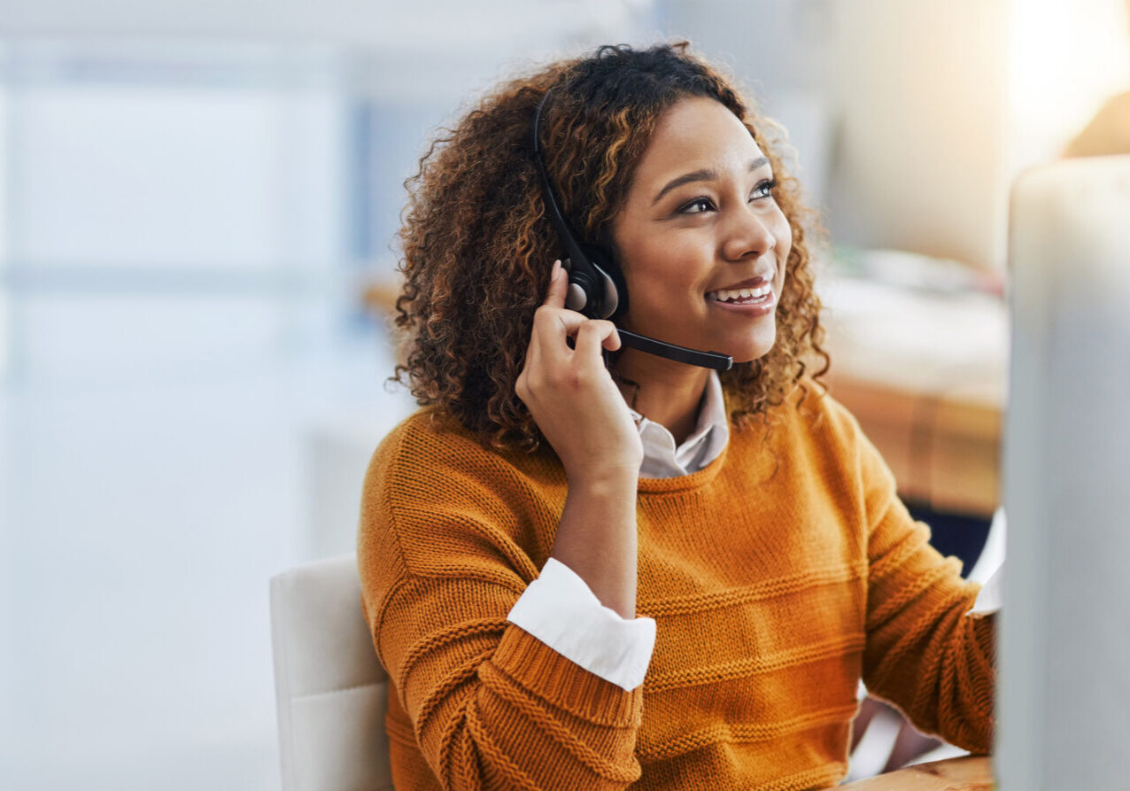 Her display of care in customers is great business. Shot of a female agent working in a call centre.